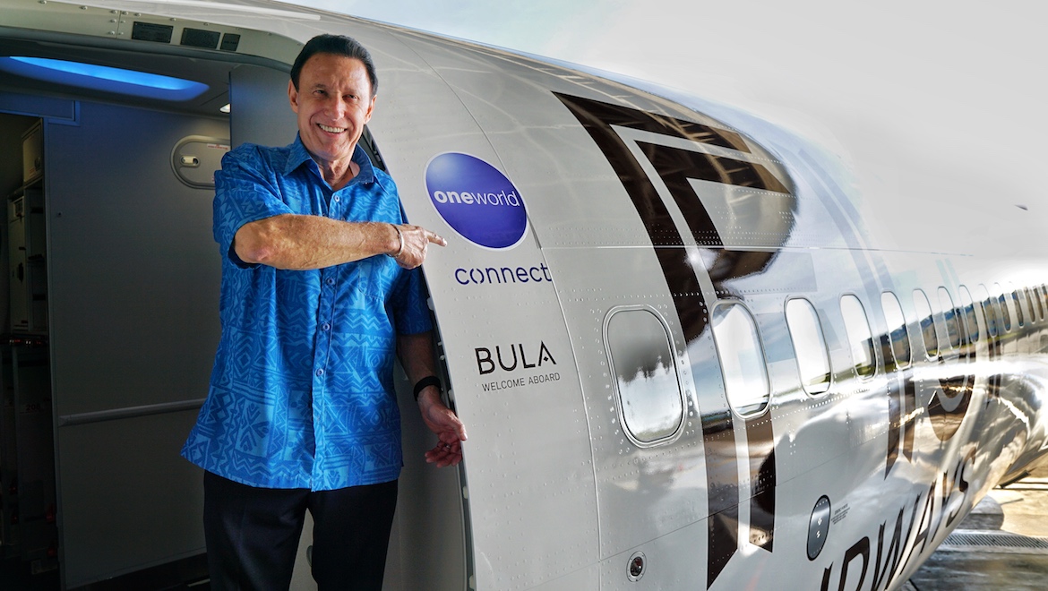 Fiji Airways chief executive Andre Viljoen in from of the airline's Boeing 737 MAX 8 featuring the oneworld connect logo. (oneworld)
