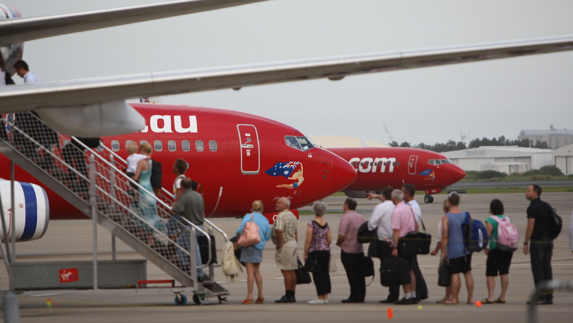 Passengers board a Virgin Blue aircraft. (Australian Aviation)
