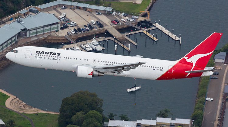 A file image of Qantas Boeing 767 VH-OGL over Sydney Harbour. (Seth Jaworski)