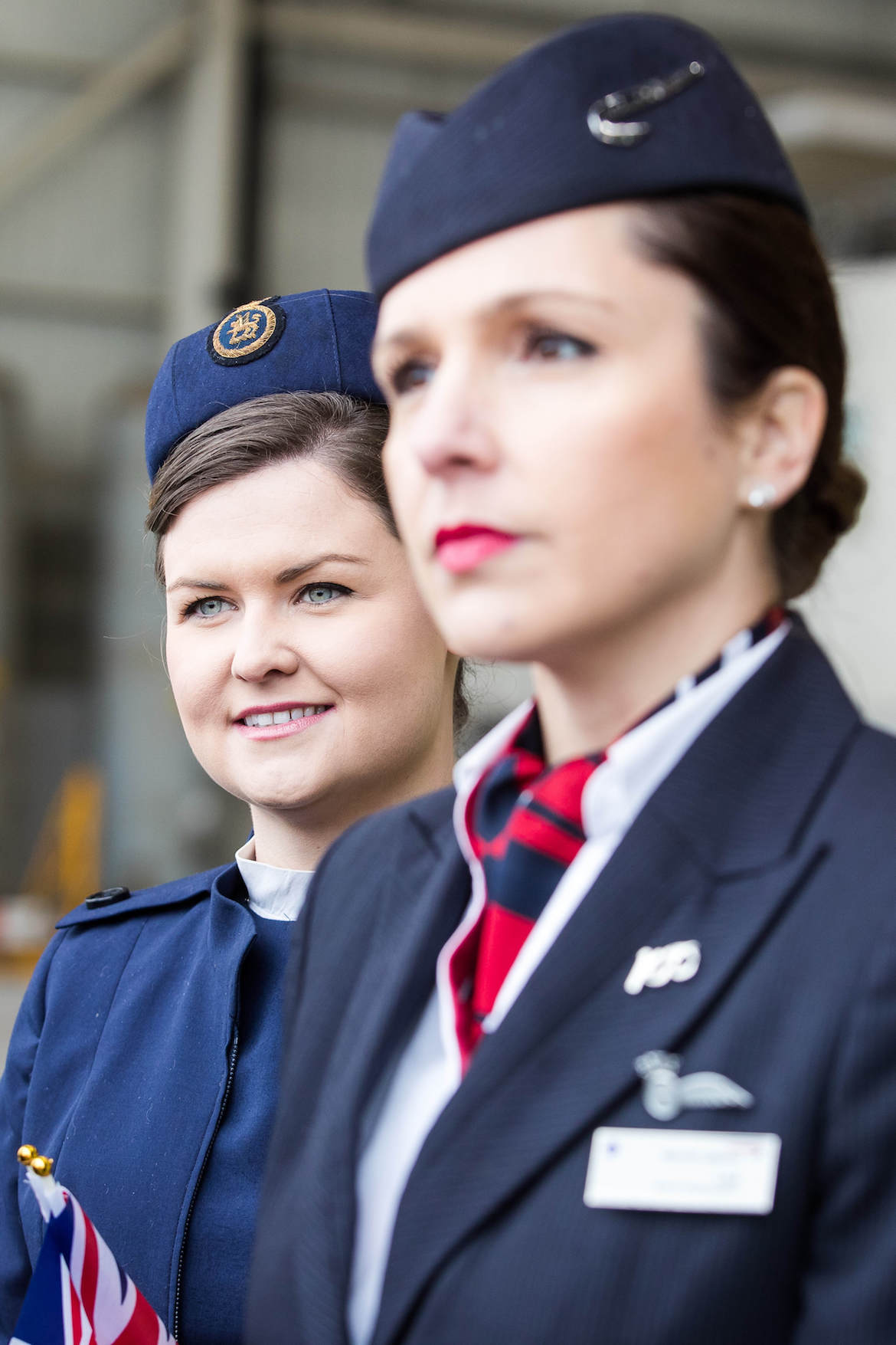 British Airways staff in current and previous uniform wait for the arrival of the 747-400 in BOAC livery. (British Airways)