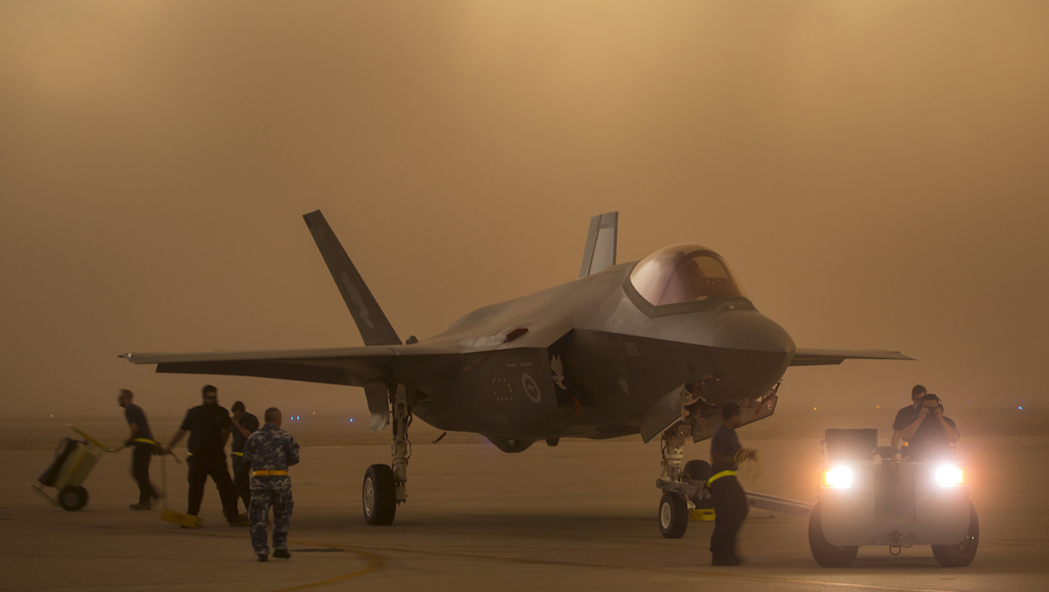 A RAAF F-35 is towed to shelter at Luke during a dust storm. (Defence)