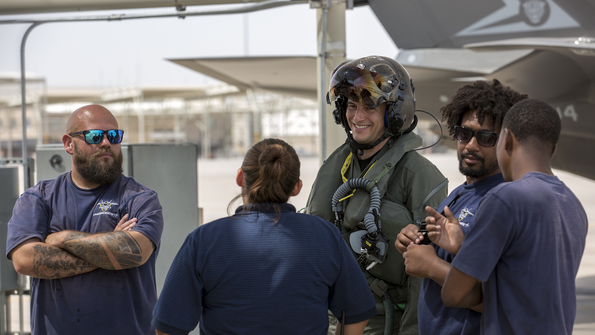 Royal Australian Air Force F-35A pilot Flight Lieutenant Ross Bowman (centre), with Lockheed Martin maintenance personnel at Luke Air Force Base. (Defence)
