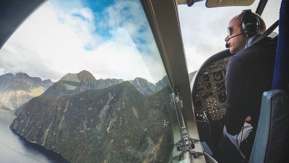 Air Milford pilot Alex Turnbull flyiing over Milford Sound. (Air Milford)