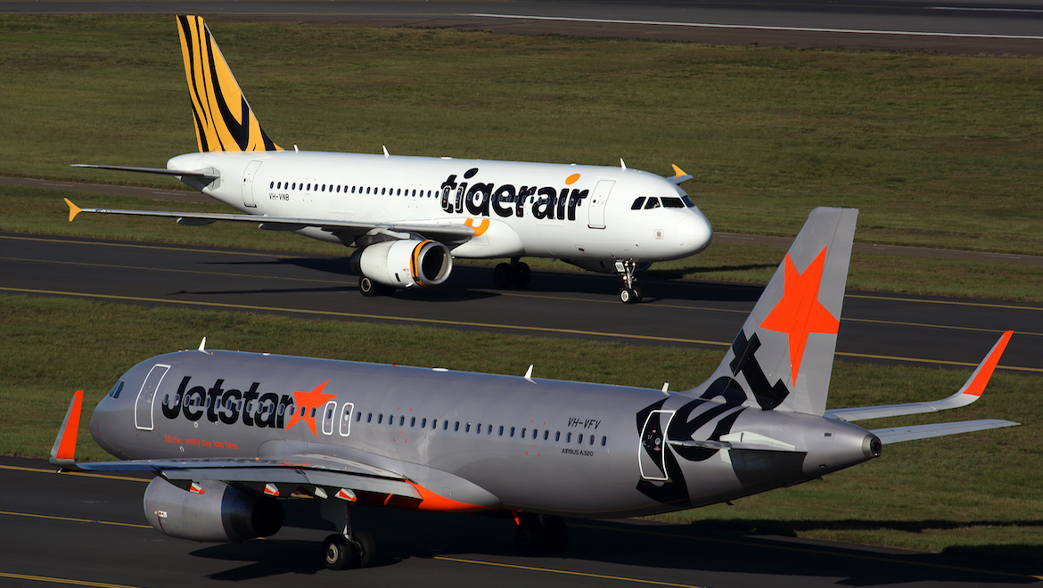 A file image of a Jetstar and a Tigerair Australia Airbus A320 at Sydney Airport. (Rob Finlayson)