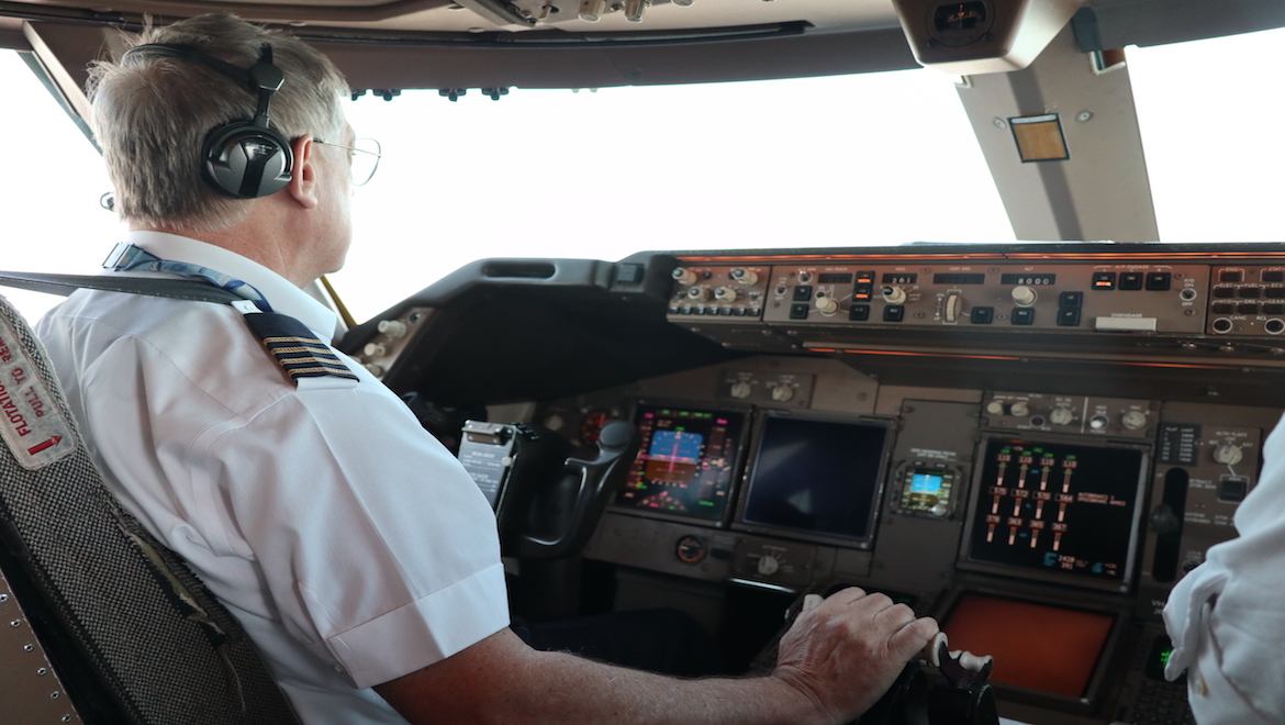 Qantas Captain Mark Kelly in the flight deck of Boeing 747-400 VH-OJU. (Owen Zupp)