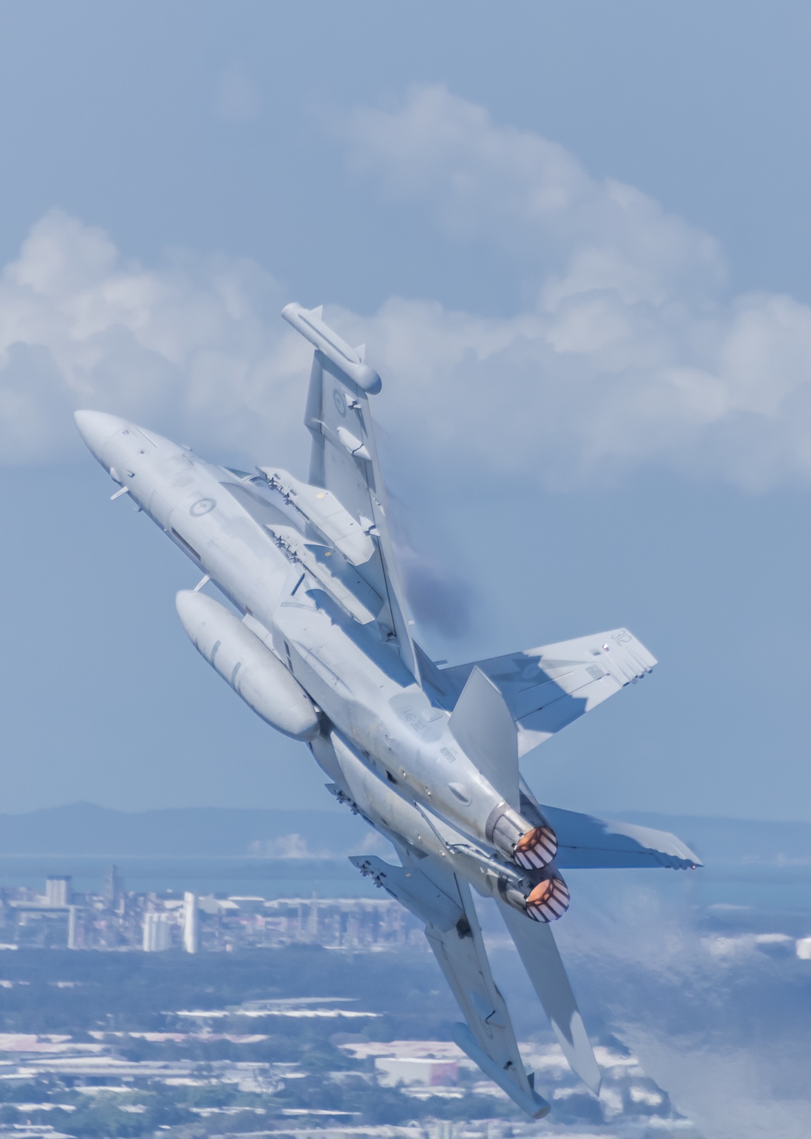 Showing off: an EA-18G, minus its jamming pods, on display over Brisbane and presenting a clear view of its underwing, external stores stations. (Mark Greenmantle)