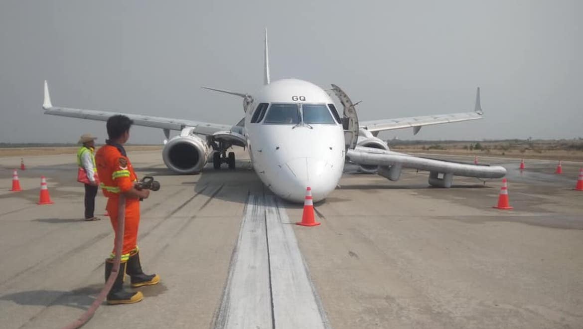An image of Myanmar National Airlines Embraer E190 XY-AGQ after it landed without its nose gear extended. (Myanmar National Airlines/Facebook)