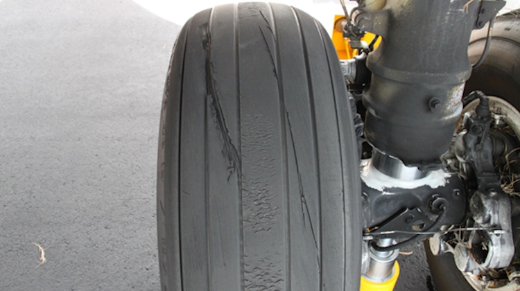 The tyre damage on VH-VUI. (ATSB)