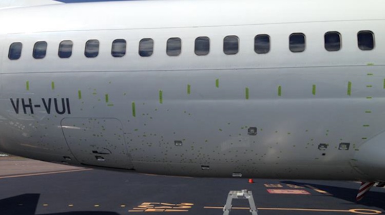 The fuselage damage, marked with green tape, on VH-VUI. (ATSB)