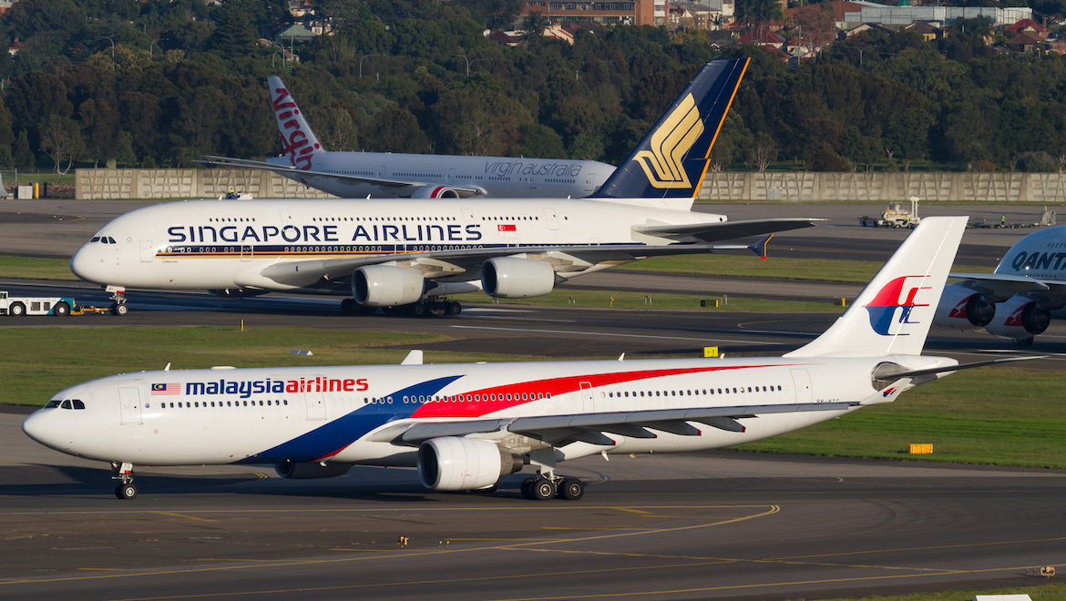 A MH Airbus A330 and SQ A380 at Sydney Airport. (Seth Jaworski)