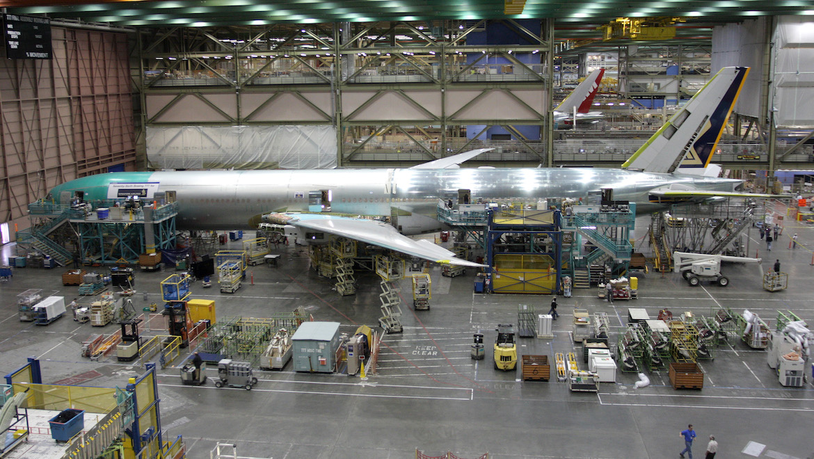 A largely assembled 777-300ER for Singapore Airlines, the airline’s 76th 777, prepares to receive its engines, wing-body fairings, and other external and internal finishing touches before being rolled out of the Everett assembly line. (Andrew McLaughlin)