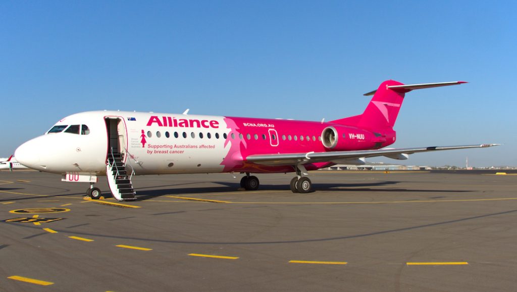 Alliance Aviation Services Fokker 70 VH-NUU has a special Pink Lady livery. (Dave Parer)