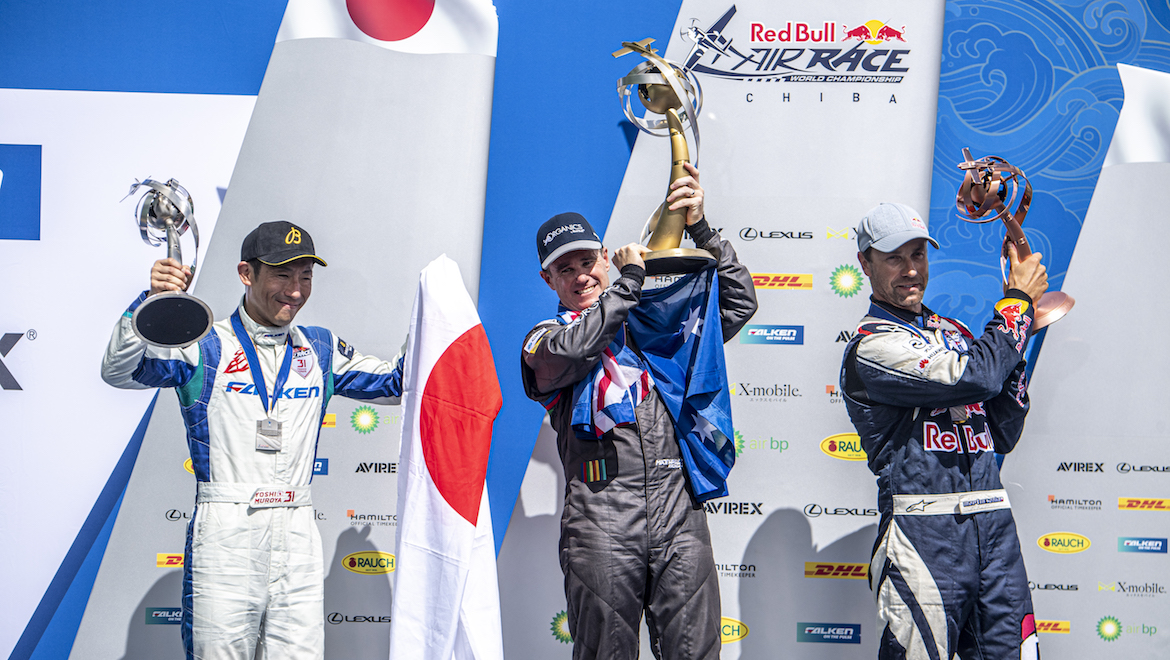 Australia's Matt Hall (centre), with Yoshihide Muroya of Japan (left) and Martin Sonka of the Czech Republic (right) at the Red Bull Air Race world championship awards ceremony. (Red Bull Content Pool)