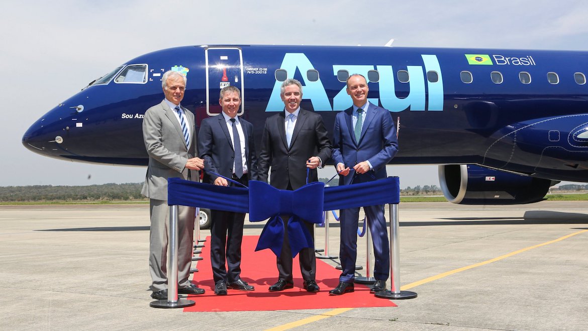 Representatives from Azul, AerCap and Embraer cut the ribbon on the first delivery of the E195-E2 regional jet. (Embraer/Twitter)