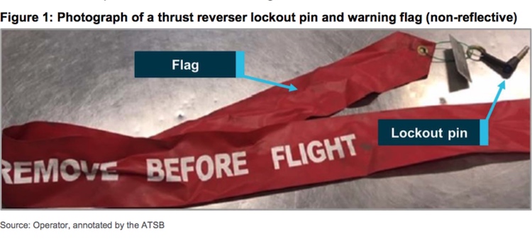 A thrust reverser lockout pin and warning flag. (ATSB)