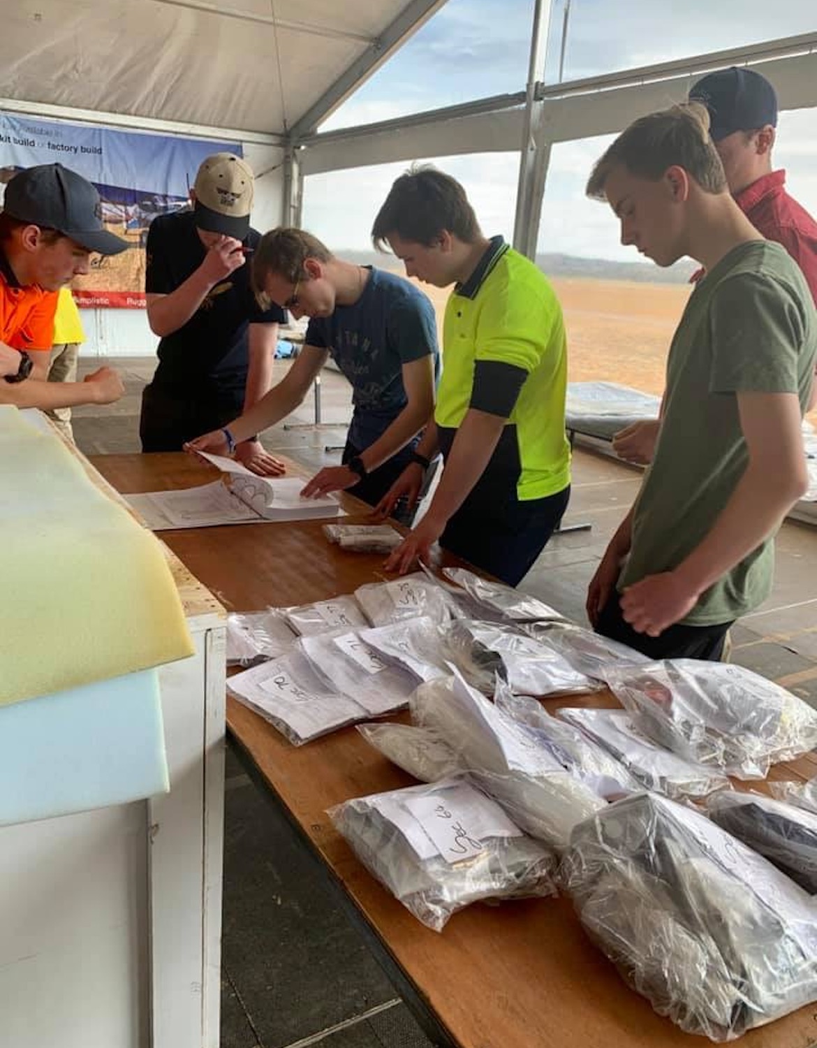 Students go through the inventory during the BushCat seven-day build at the AirVenture Australia airshow. (Marena Janse van Rensburg)