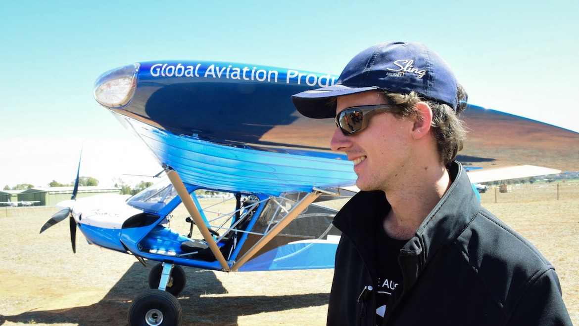 One of the students in front of the completed BushCat that was built in seven days and flew at the 2019 Airventure Australia airshow. (Marena Janse van Rensburg)