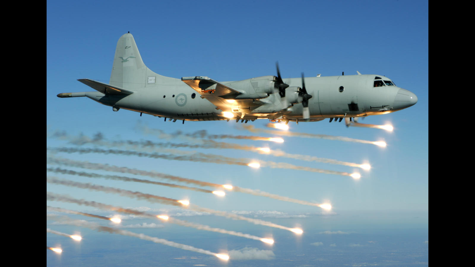 Royal Australian Air Force (RAAF) AP-3C Orion, of 92 Wing, jettisons flares during a trial of electronic warfare self-protection systems by the Aircraft Research and Development Unit (ARDU) based at RAAF Base Edinburgh, South Australia.