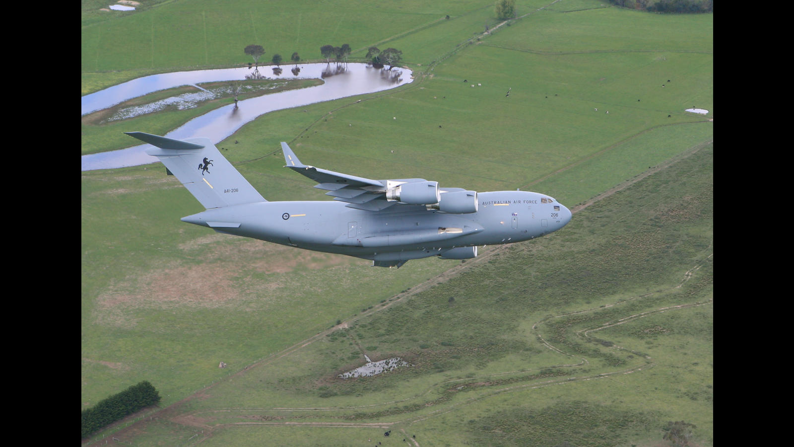 A C-17A Globemaster III aircraft visited Royal Australian Air Force Base (RAAF) East Sale for the first time on Thursday, September 27. The aircraft is operated by No. 36 Squadron (36SQN) based at RAAF Base Amberley in southern Queensland. AFIR No: 000-186-054 *** Local Caption *** The Globemaster is conducting a training flight from its home base and will use the opportunity to show the aircraft to local personnel at RAAF Base East Sale. The training sortie to Victoria will provide experience to crew members new to the Globemaster, which brings a quantum leap in air lift capability to the RAAF. The Commanding Officer of 36SQN, Wing Commander Linda Corbould, said "The Globemaster can carry almost four times the cargo of our other combat airlift workhorse, the C-130 Hercules, and fly that load faster and further. It can transport two Army Black Hawk helicopters plus their supporting equipment, or an air-transportable field hospital in a disaster relief role". The RAAF’s first two Globemaster aircraft were delivered in December 2006 and May 2007 respectively, with the final two aircraft due for delivery by mid-2008. Earlier this month, the Air Force announced the Globemaster had reached Initial Operating Capability, clearing it to support ongoing Australian Defence Force operations around the world. Final Operating Capability is expected in 2011, when permanent facilities for 36SQN will be completed at RAAF Base Amberley. The role of the C-17 will continue to expand within the RAAF to include more complex tactical roles, including airdrop of personnel and equipment, and also the aeromedical evacuation of high dependency patients.
