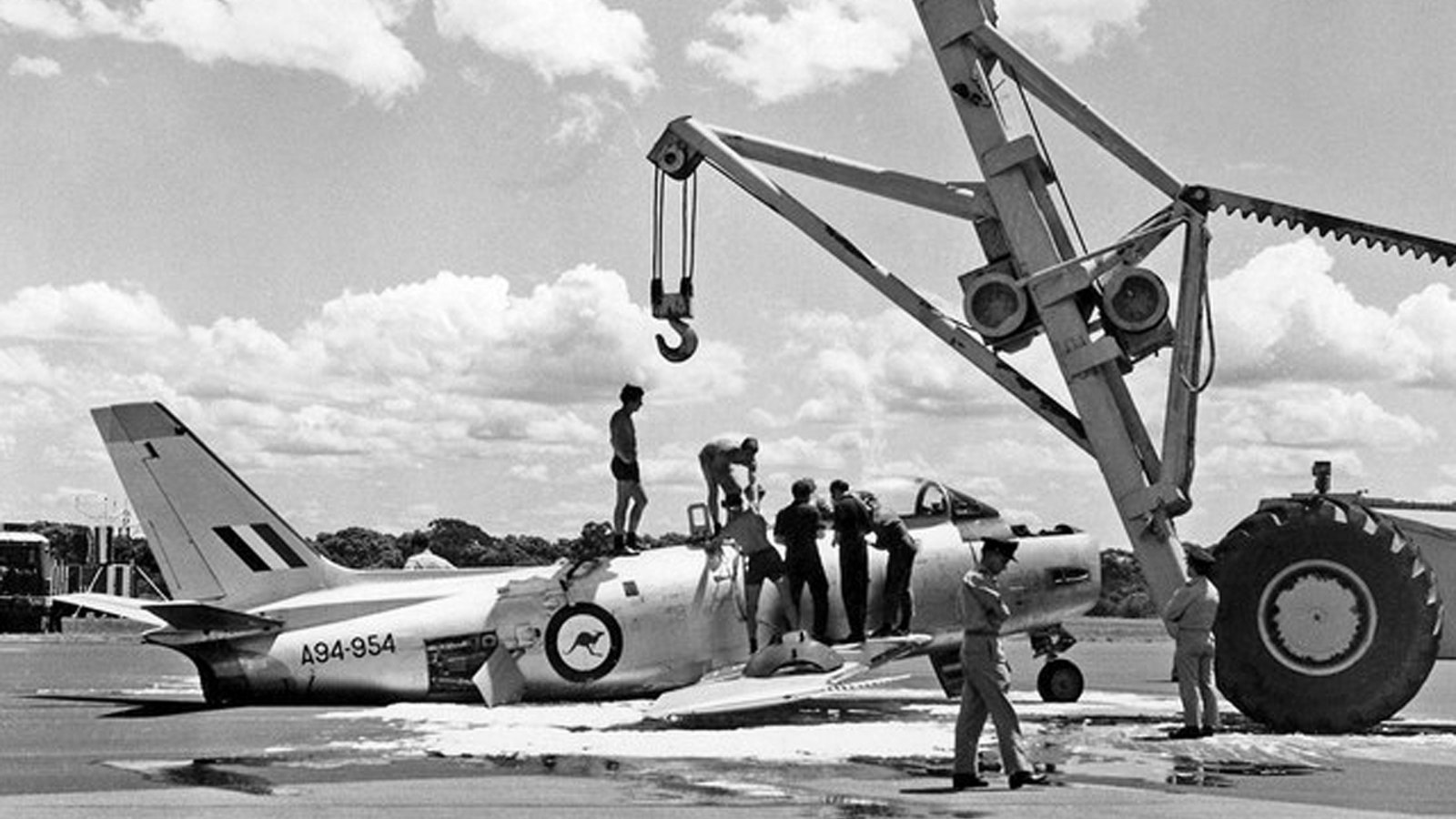 RAAF Official - CA-27 Sabre Mk32 A94-954 Williamtown Feb1970 - Photographer Unknown - via Wal Nelowkin (Recovery by Le Tourneau Crane after landing on foam with MLG wheels retracted)